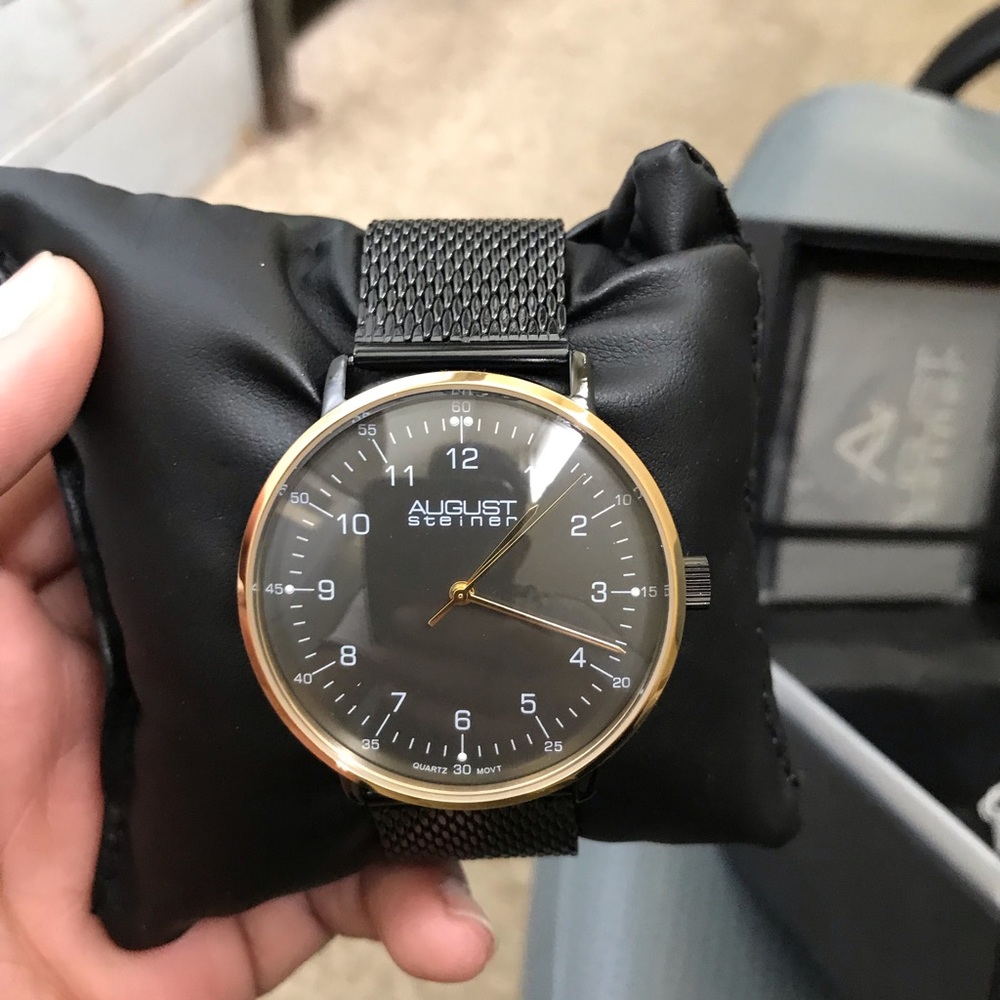 August Steiner black and gold watch